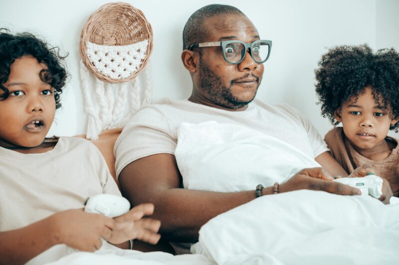 happy father with children in bedroom